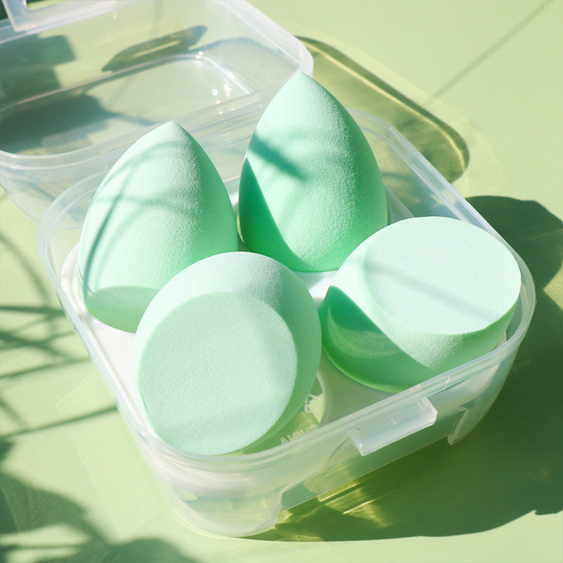 close up light green makeup powder puffs